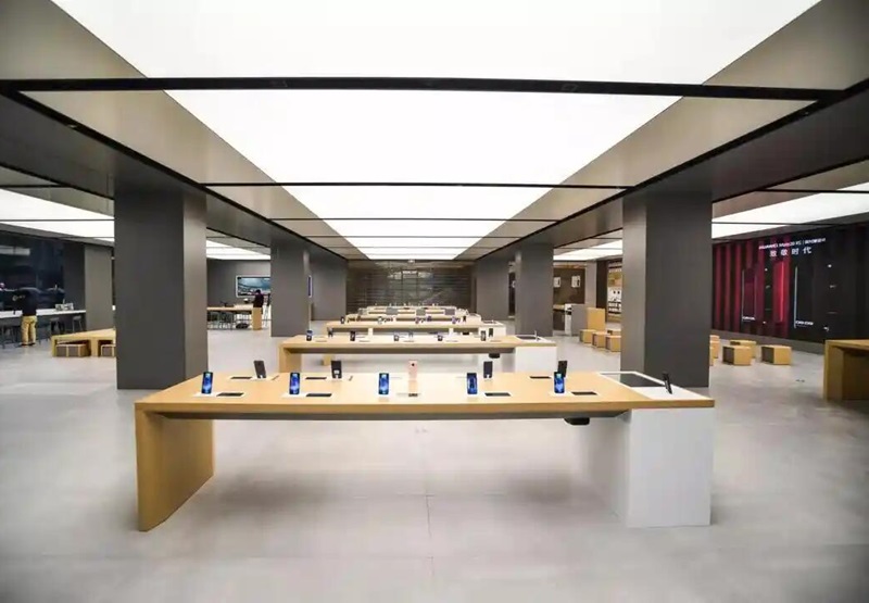Uniform LED light sheet ceiling panels in a modern retail store